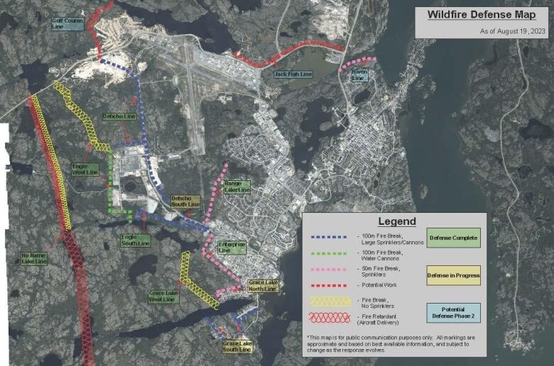 A map shows lines of colour where fire breaks, sprinklers and water cannons have been set up around a city.