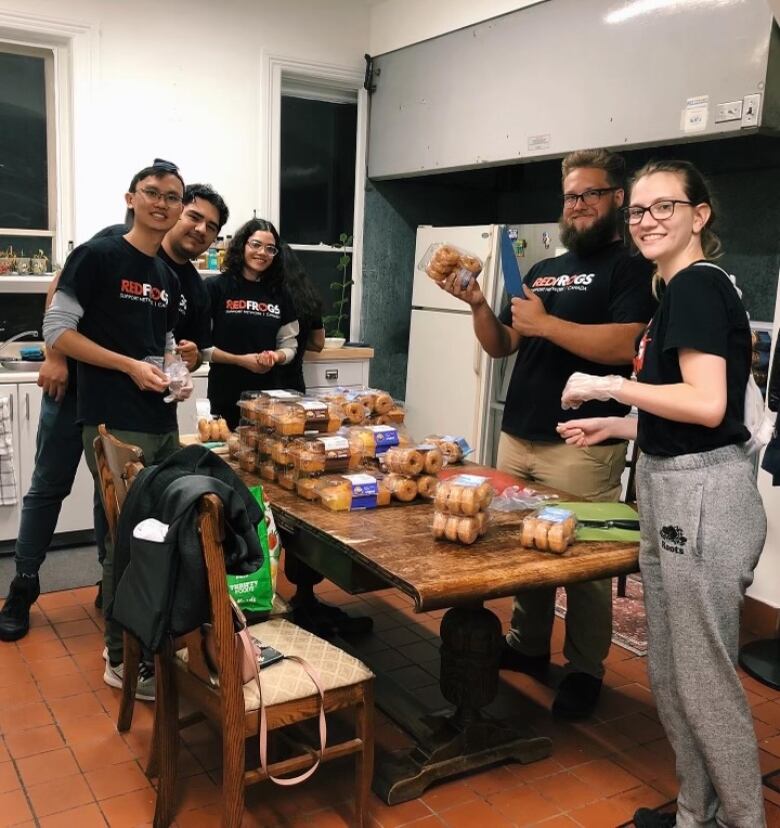 Red Frogs volunteers pictured with donuts to hand out to late-night partygoers at the University of Windsor.