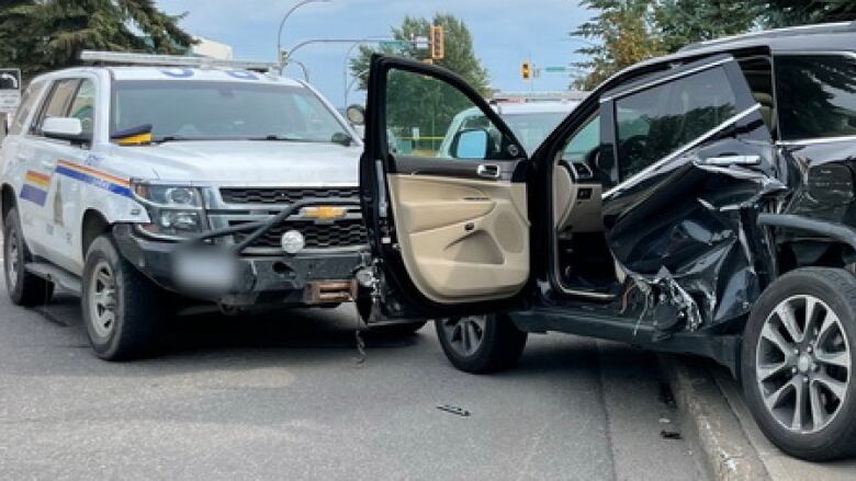 A black car with extensive side door damage and an RCMP cruiser with a mangled front bumper are seen in close proximity.