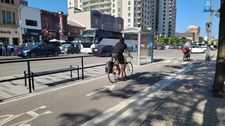 Cyclists travel eastbound on the Dundas portion of the Core Cycling Network on Aug. 22, 2023.