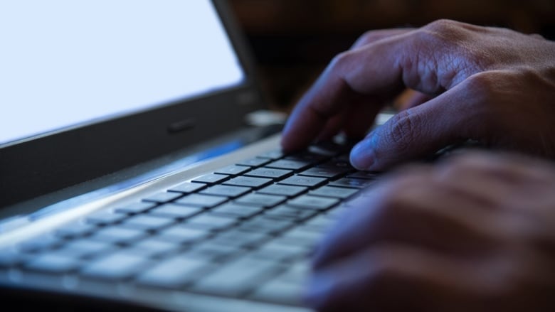 Selective focus on man two hand typing laptop/PC/computer keyboard in night dark tone low key; Shutterstock ID 492858532; Cost Ctr: redownload; Manager: redownload; Email: redownload; Project: redownload