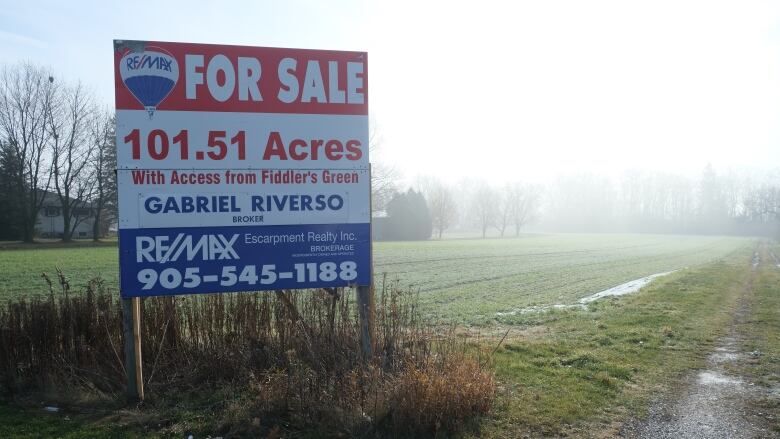 farmland and for sale sign