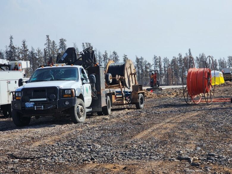 A truck with communications lines is pictured