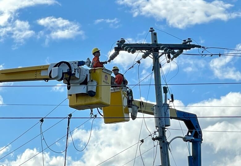 Power crews in Charlottetown pictured on Kirkdale Road working to repair power lines damaged by Hurricane Fiona.