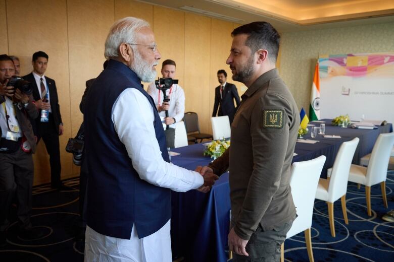 In this photo provided by the Ukrainian Presidential Press Office, Ukraine President Volodymyr Zelenskyy, right, and Indian Prime Minister Narendra Modi meet at the Grand Prince Hotel during the G7 Summit in Hiroshima, Japan on May 20, 2023.