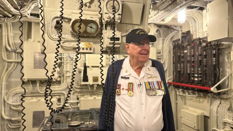 Man in control room of boat