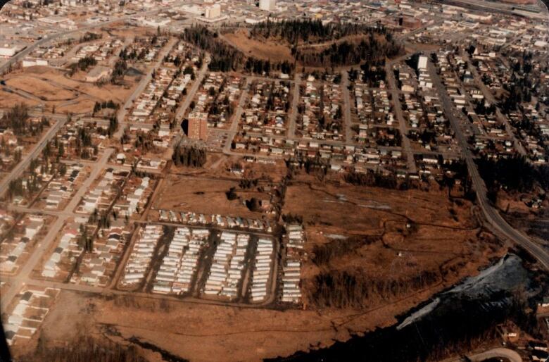 An aged photo of the property from above.