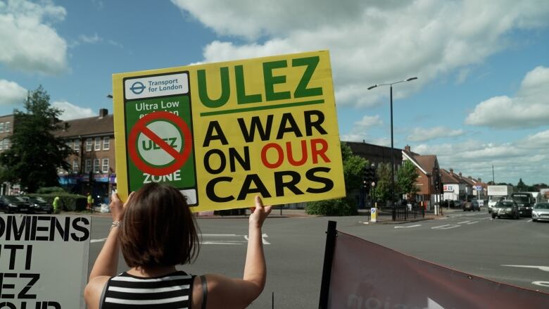 A protestor holds up an anti-Ulez placard at a recent protest in Sutton,  Greater London.