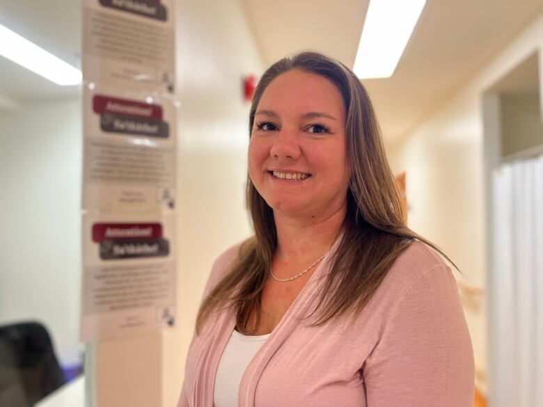 Robin Guyer standing next to the entrance of the new medical imaging department at the Kateri Memorial Hospital Centre.