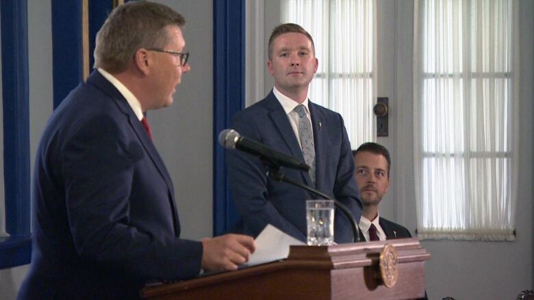 New Minister of Education Jeremy Cockrill (right) looks on as Premier Scott Moe announces his appointment to cabinet. 