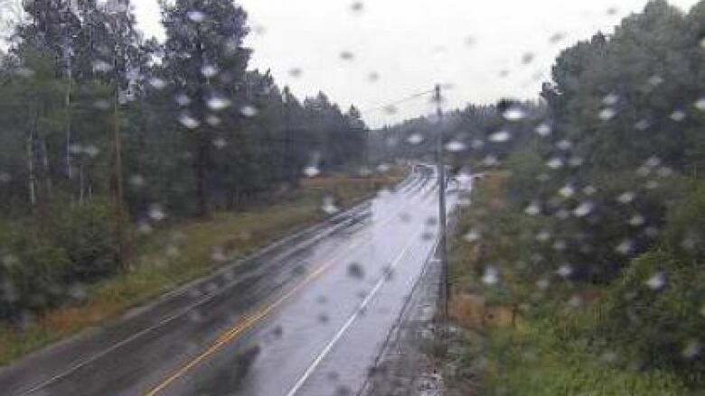 Rain on the lens of a camera on Highway 3 looking southeast near Cranbrook B.C.