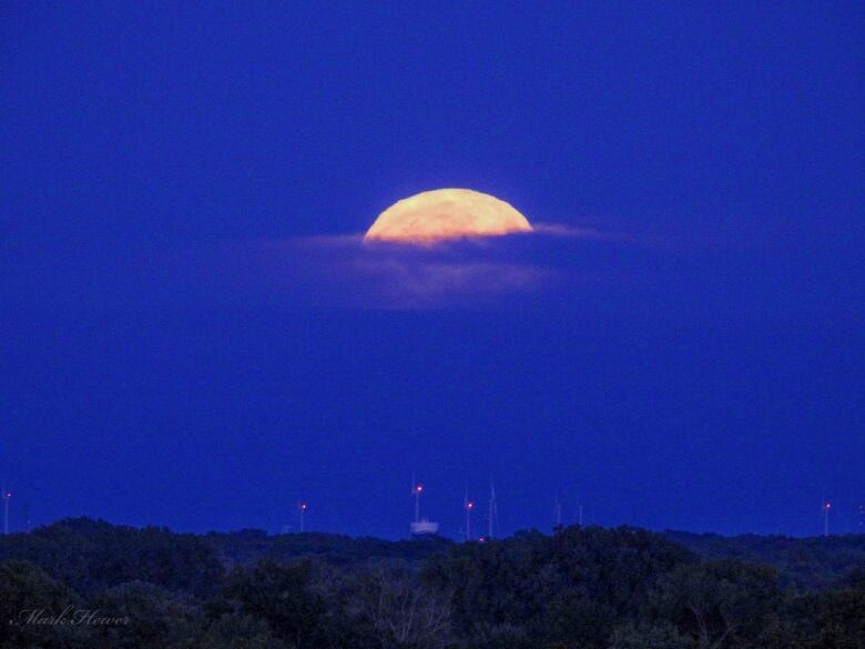 Super blue moon is photographed from Windsor, Ont., Aug. 30, 2023.