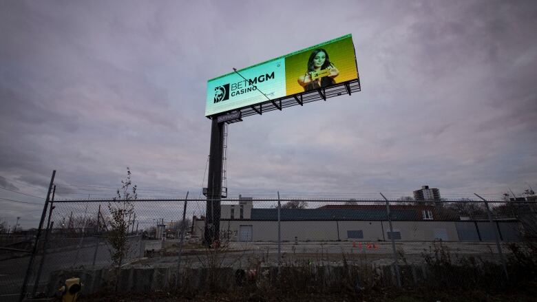 A billboard displaying an ad for an online casino game service is seen in Toronto in November 2022.