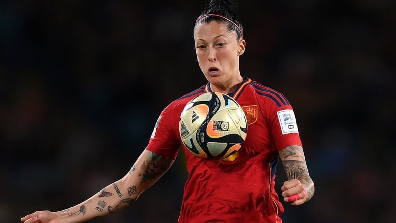 Spanish women's soccer player tries to gain possession of the ball during a World Cup match.