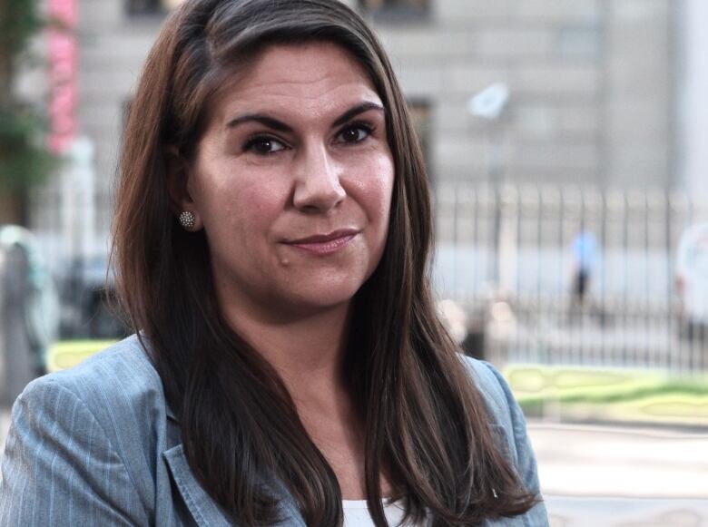 A woman with long brown hair.