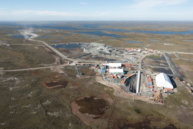 Buildings on tundra, lakes.