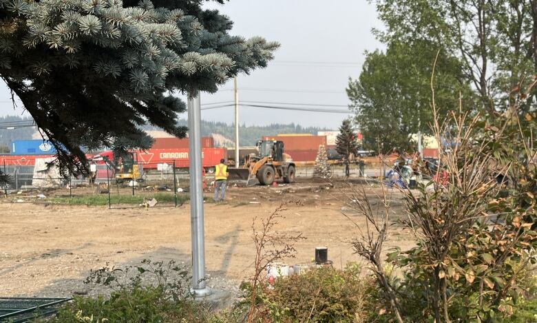 Dirt and heavy machinery on a park site.