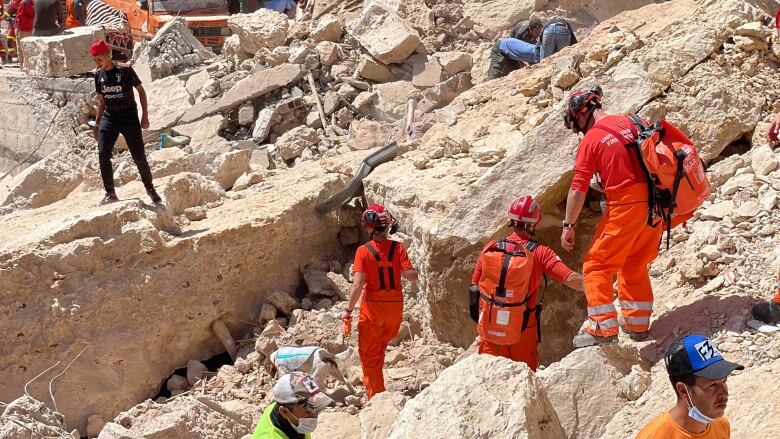 British search and rescue teams survey the damage in the town of Imin Tala,  75 kilometres southwest of Marrakesh. 