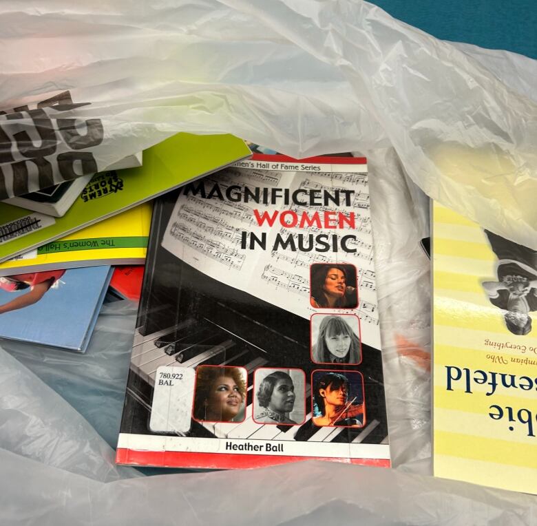 Library books in a plastic bag.