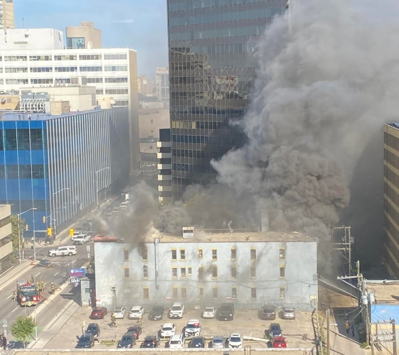 Plumes of grey smoke was billowing out of the Windsor Hotel in downtown Winnipeg Wednesday morning. 