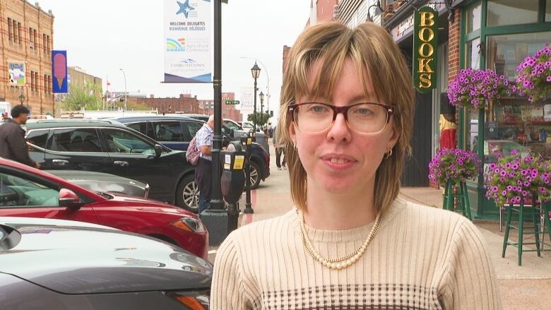 Jo Morrison of Charlottetown Mutual Aid on city sidewalk.