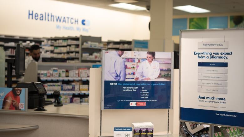 Signage explaining that pharmacists are able to provide prescriptions for minor health conditions is photographed at a Shoppers Drug Mart in Toronto on January 11, 2023.