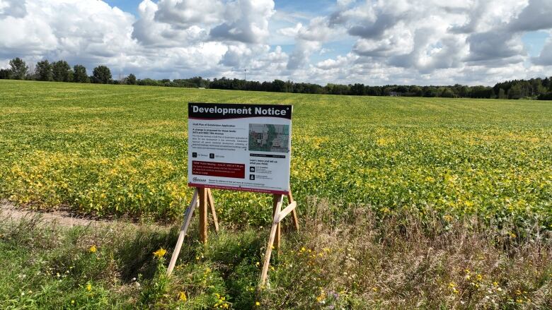 A sign with information about a proposed development.