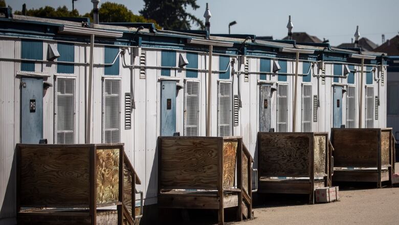 Portable classrooms are pictured on a sunny day.