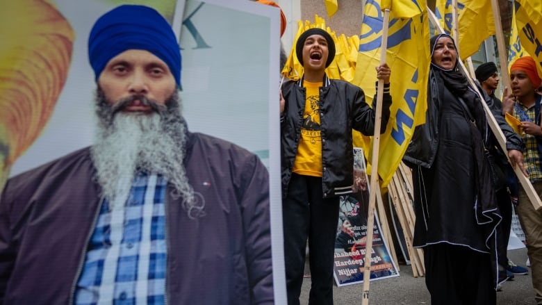 Protesters chant outside of the Consulate General of India office during a protest for the recent shooting of Hardeep Singh Nijjar in Vancouver on Saturday, June 24, 2023.