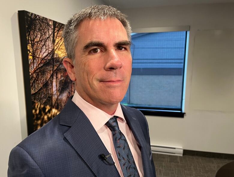 A portrait style photo of lawyer Geoff Budden in his St. John's office.