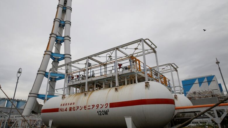 General view shows an ammonia tank in the foreground at JERA's Hekinan thermal power station in Hekinan, central Japan.