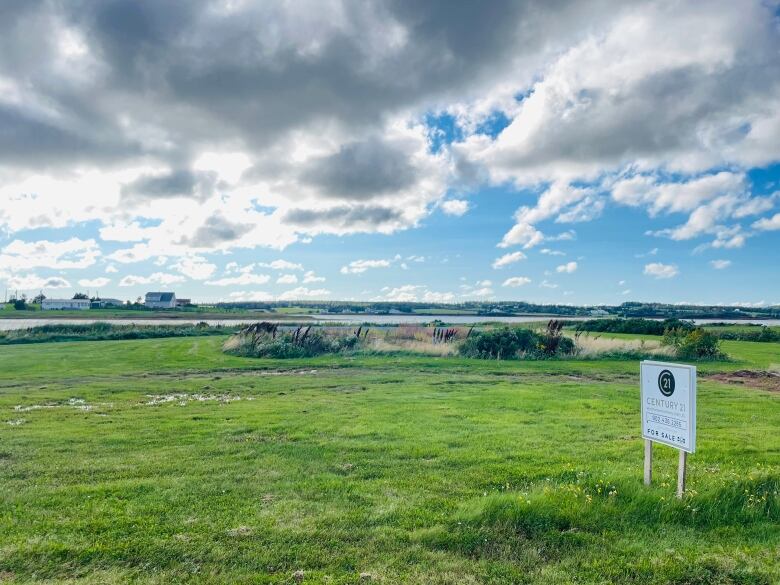 A real estate sign sits on a waterfront property in the Hebrides, along P.E.I.'s north shore. 