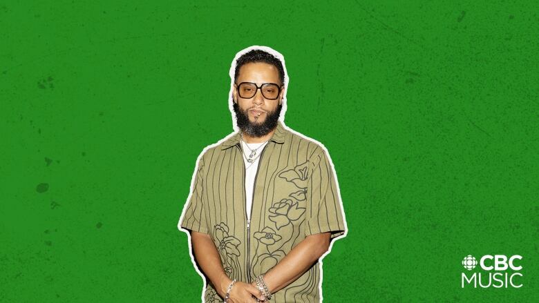 Director X wears a green striped shirt and matching pants while wearing tinted sunglasses and silver necklaces.