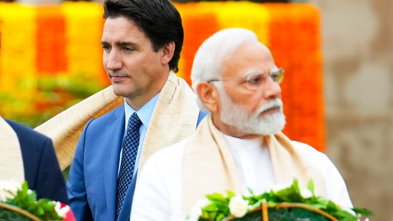 Canada's Prime Minister Justin Trudeau, left, walks past Indian Prime Minister Narendra Modi as they take part in a wreath-laying ceremony at Raj Ghat, Mahatma Gandhi's cremation site, during the G20 Summit in New Delhi on Sunday, Sept. 10, 2023. 