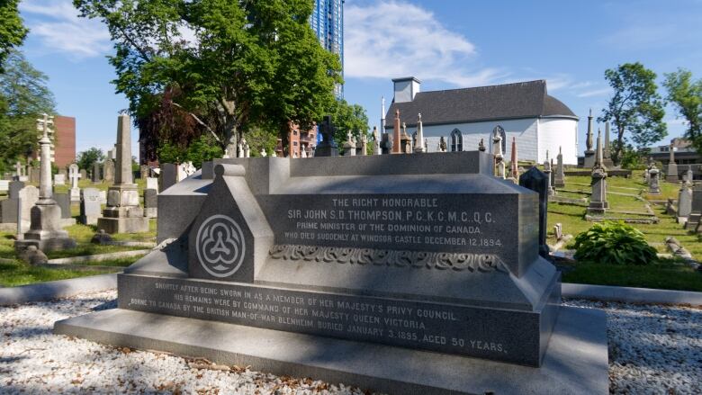 An elevated granite grave marker.