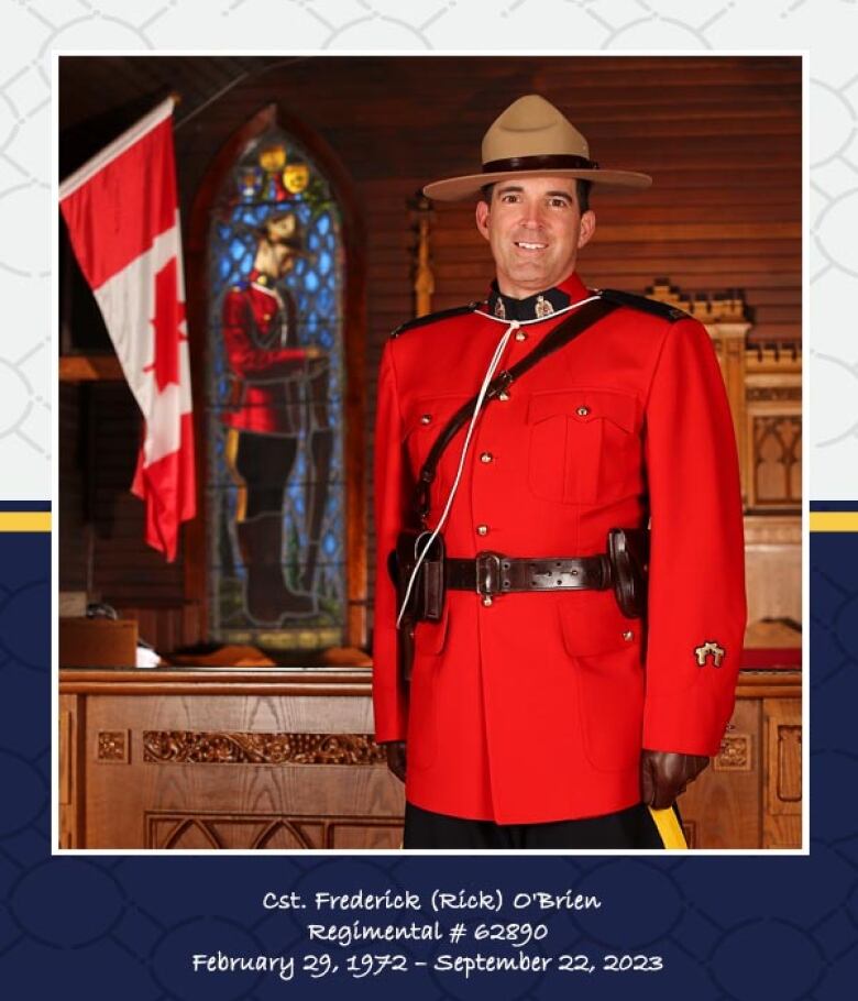 A man in an RCMP red outfit stands smiling. 