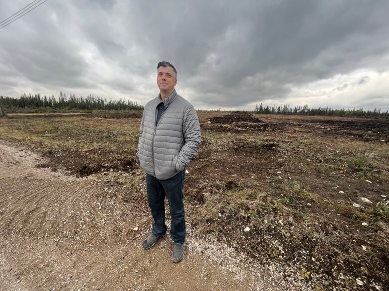 Blair Porter stands next to the firebreak cleared in Enterprise, N.W.T.