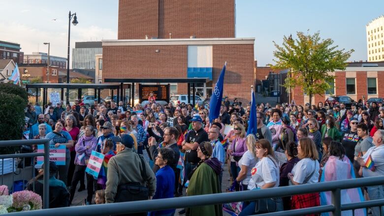 A crowd shot of people outside.