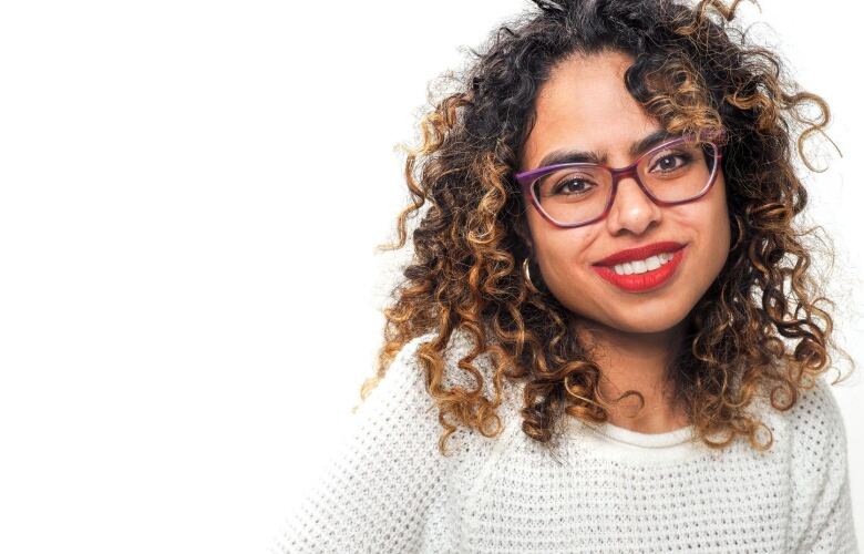 A woman poses for a photo.