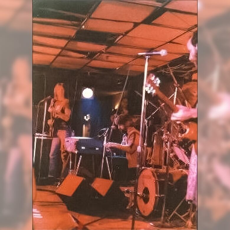 A grainy photo shows a rock band playing at a small Halifax nightclub.