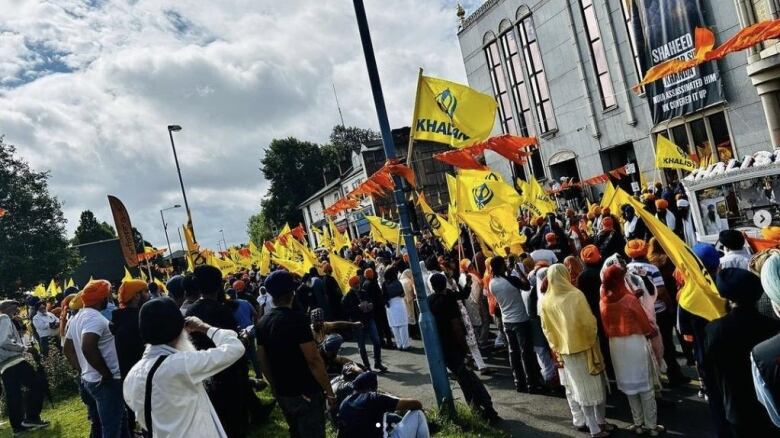 Avtar Singh Khanda's funeral procession outside the Guru Nanak Gurdwara in Smethwick,  near Birmingham.