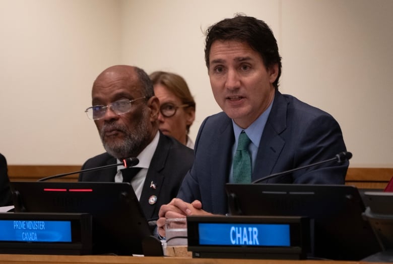 Haitian Prime Minister Ariel Henry looks on as Prime Minister Justin Trudeau delivers opening remarks at an event focusing on Haiti at the United Nations, Thursday, Sept. 21, 2023 in New York.