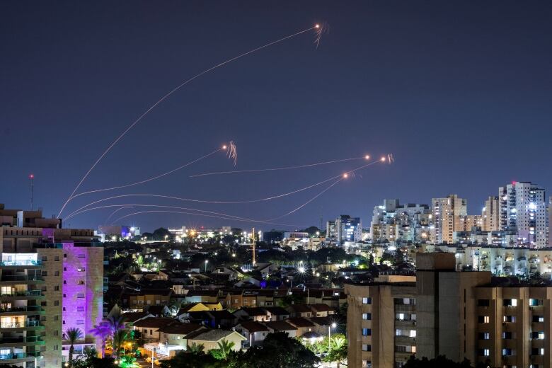 Rockets and entrials seen in a night sky