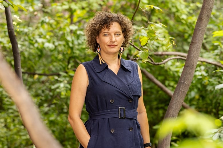 Woman standing in forest