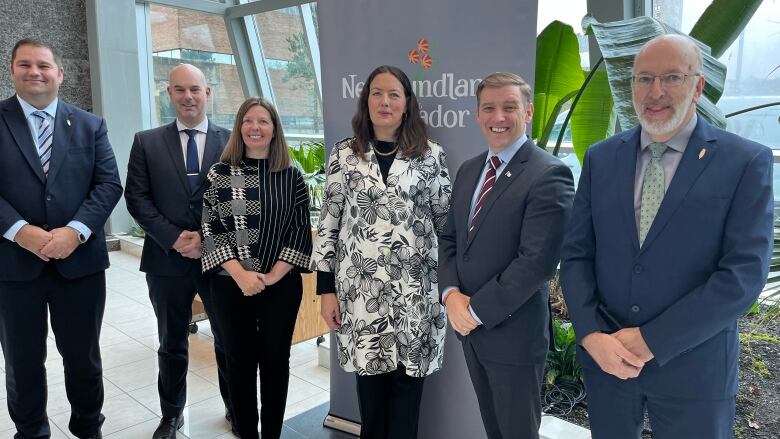 a group photo of the key players who took part in a carbon capture and storage announcement on Memorial University on Tuesday.