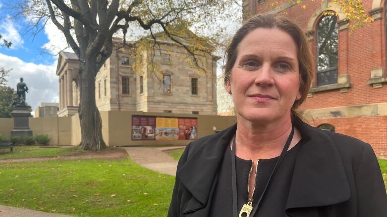 Cheryl Paynter standing in front of Coles Building.