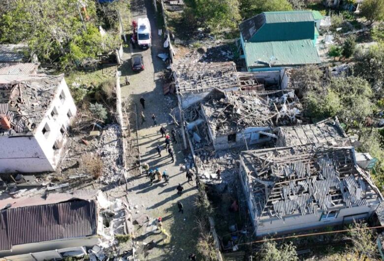 An image showing damaged that a Russian missile caused in the Ukrainian village of Obukhivka.