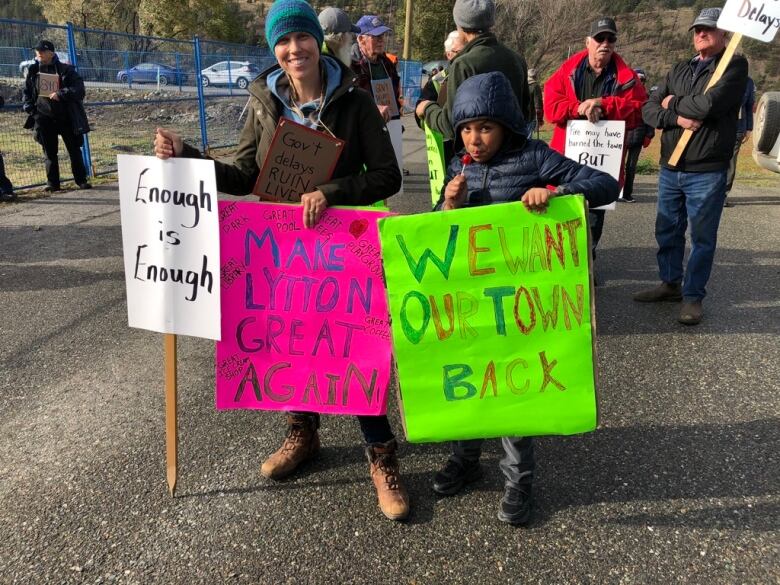 Protestors with colourful signs