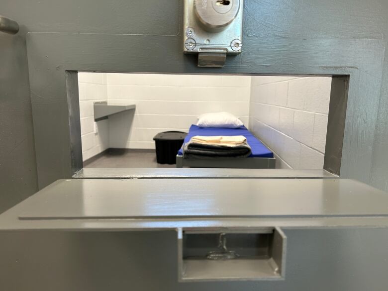 One of the maximum-security rooms at the new women's unit, seen through the slot where meals are pushed through into the cell.  