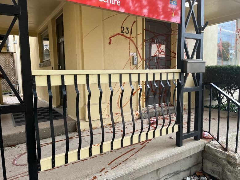 Empty ketchup bottles can be seen on the ground, mostly empty after being used to spray Fragiskatos' office on Sunday.